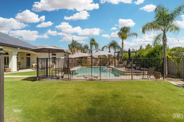 view of swimming pool with a yard and a patio