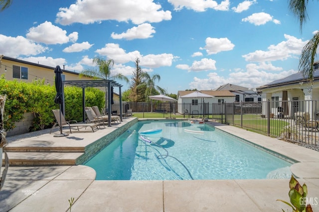 view of swimming pool with a patio, a lawn, and a pergola