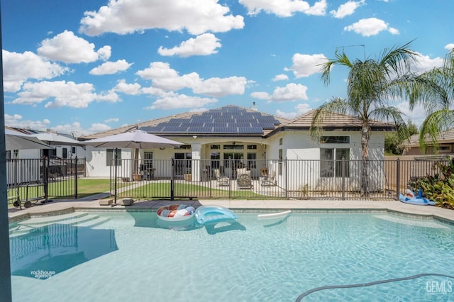 view of pool with a lawn