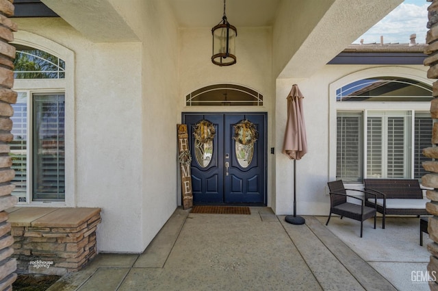 entrance to property featuring french doors