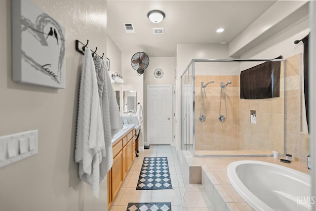 bathroom with tile patterned floors, vanity, and plus walk in shower