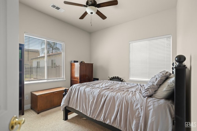 bedroom with light carpet and ceiling fan