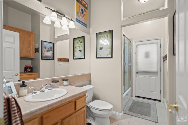 full bathroom with vanity, tile patterned flooring, enclosed tub / shower combo, and toilet