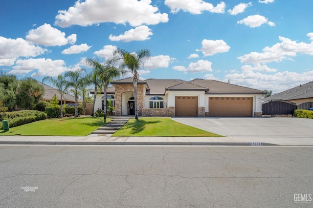 view of front of house with a garage and a front yard