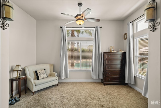 sitting room with light carpet and ceiling fan