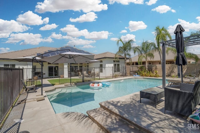 view of swimming pool with a patio area