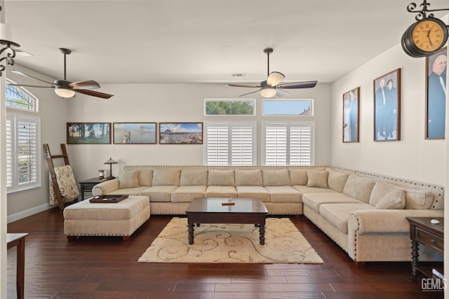 living room featuring dark hardwood / wood-style flooring and ceiling fan