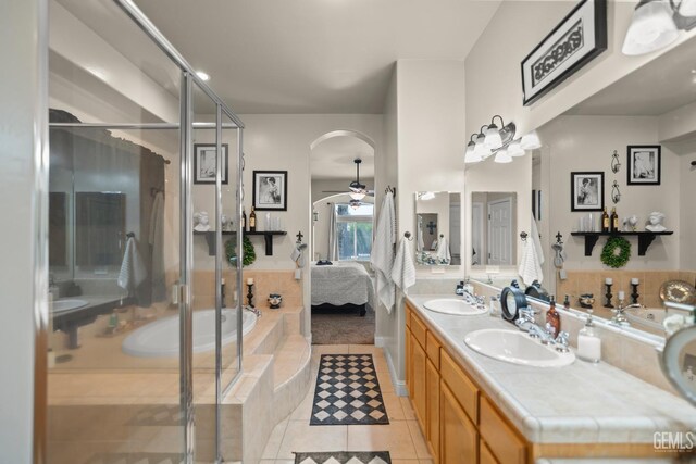 bathroom with vanity, separate shower and tub, tile patterned floors, and ceiling fan