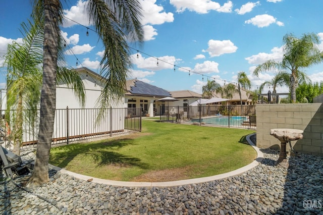 view of yard featuring a fenced in pool