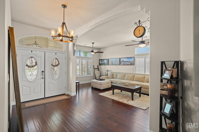 entryway with dark hardwood / wood-style flooring and ceiling fan with notable chandelier