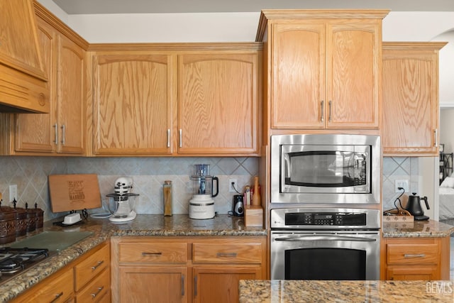 kitchen with stainless steel appliances, tasteful backsplash, and stone counters