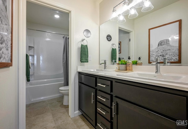 full bathroom featuring tile patterned flooring, shower / bath combo, vanity, and toilet