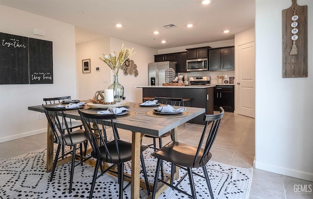 dining area with light tile patterned flooring