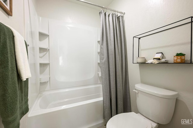 bathroom featuring shower / tub combo with curtain and toilet