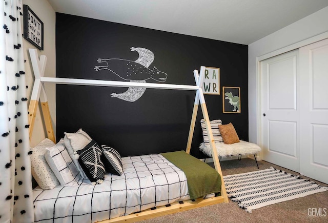 carpeted bedroom featuring a closet