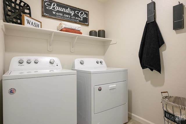 clothes washing area with washer and dryer