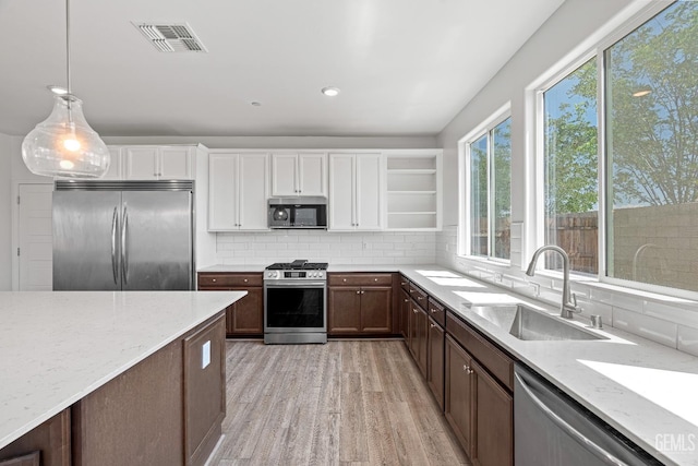 6501 Thunder Trail Dr, Bakersfield, CA 93313 - kitchen with stainless steel appliances, light wood-style floors, white cabinetry, light stone counters, and recessed lighting