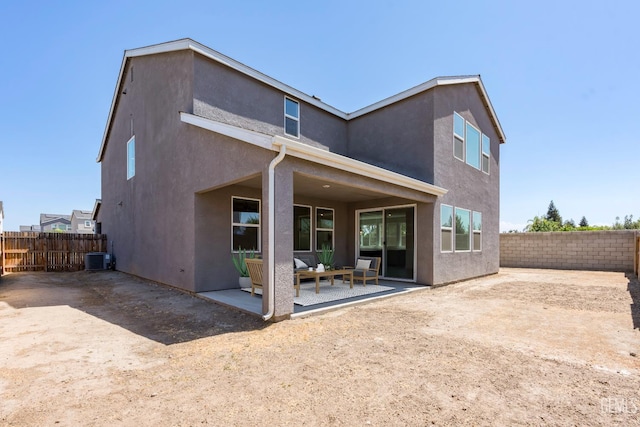 6501 Thunder Trail Dr, Bakersfield, CA 93313 - rear view of house featuring a patio, stucco siding, outdoor lounge area, and a fenced backyard