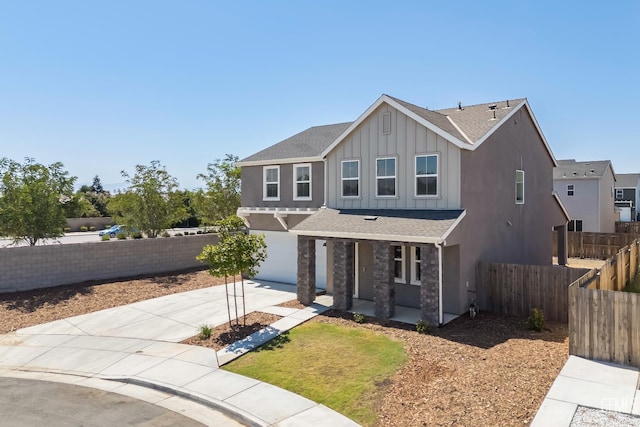 6501 Thunder Trail Dr, Bakersfield, CA 93313 - view of front of home with board and batten siding, concrete driveway, a garage, roof with shingles, and a porch