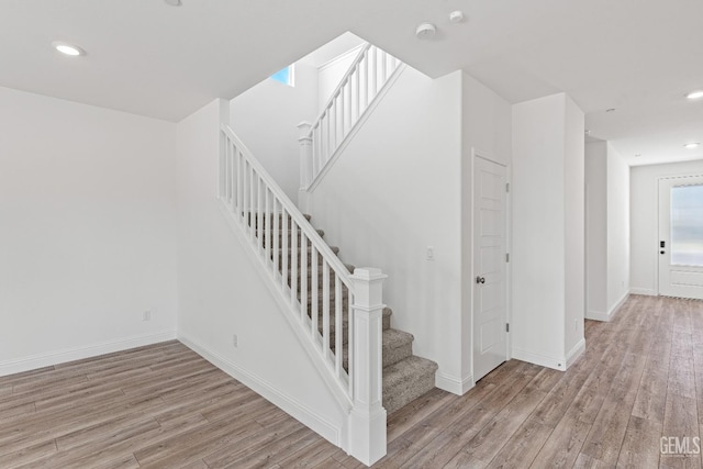 6501 Thunder Trail Dr, Bakersfield, CA 93313 - stairway with wood finished floors and recessed lighting