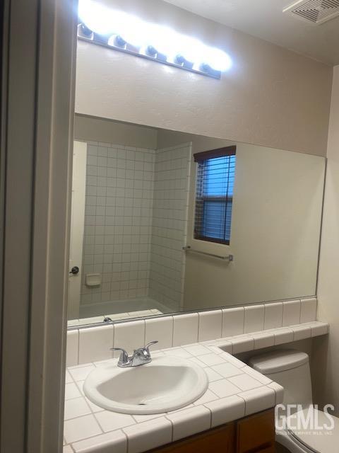 11422 Pacific Harbor Ave, Bakersfield, CA 93312 - bathroom featuring vanity and toilet