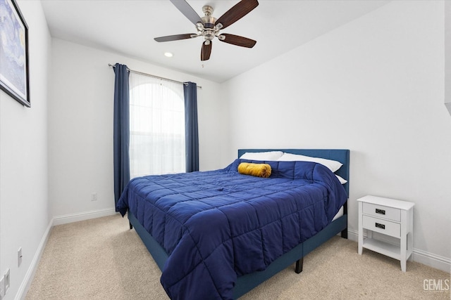 bedroom featuring carpet, baseboards, and a ceiling fan