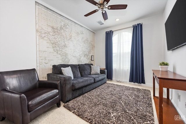 living area with visible vents, a ceiling fan, and recessed lighting