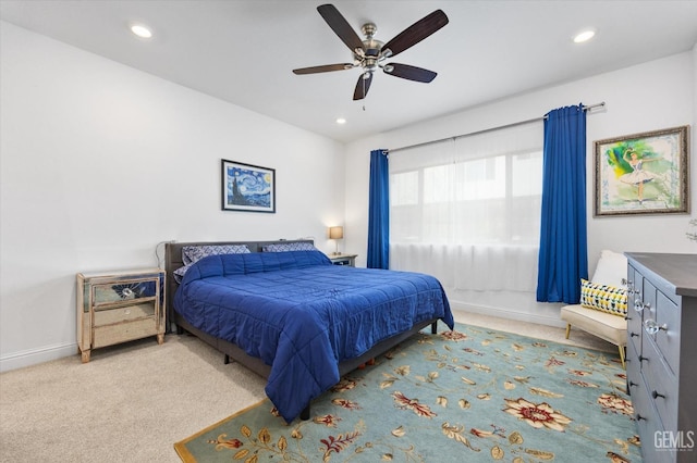 carpeted bedroom featuring baseboards, a ceiling fan, and recessed lighting