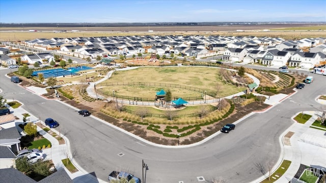 birds eye view of property with a residential view