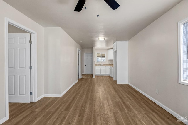 corridor with wood-type flooring