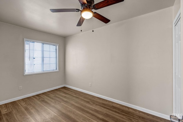 unfurnished room with hardwood / wood-style floors and ceiling fan