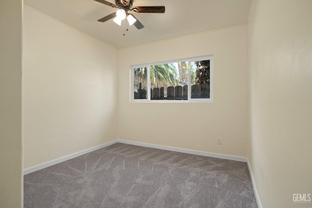 carpeted empty room featuring ceiling fan