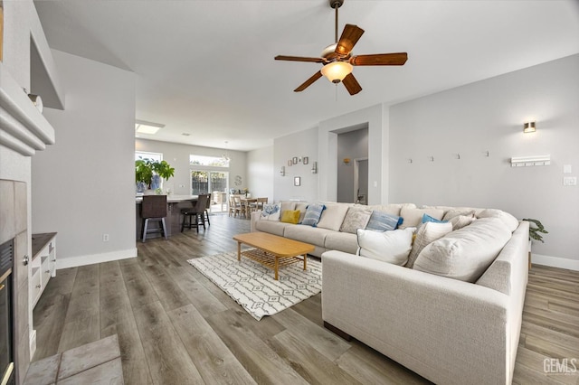 10809 Mirage Dr, Bakersfield, CA 93311 - living area with a ceiling fan and dark wood-type flooring