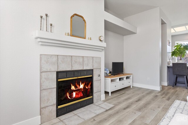 10809 Mirage Dr, Bakersfield, CA 93311 - living area with a fireplace and light wood-style flooring