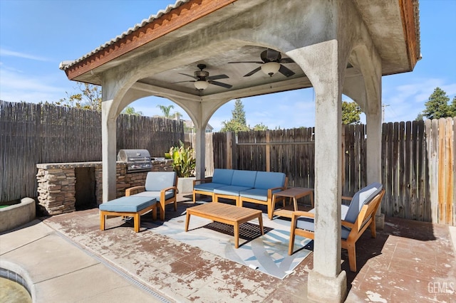 10809 Mirage Dr, Bakersfield, CA 93311 - fenced backyard with area for grilling, a patio, a ceiling fan, and an outdoor hangout area