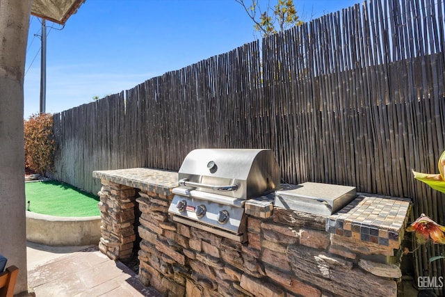 10809 Mirage Dr, Bakersfield, CA 93311 - fenced backyard featuring exterior kitchen