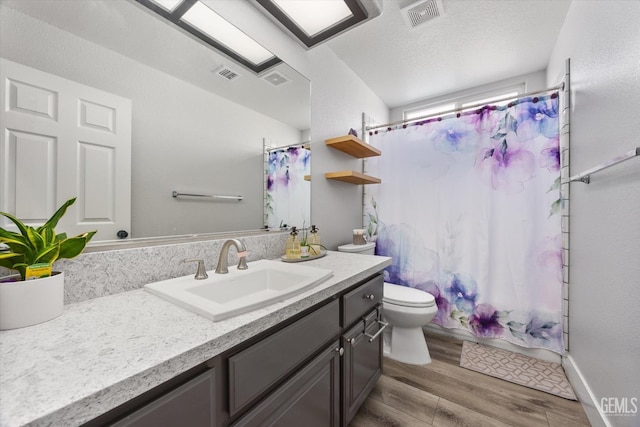 10809 Mirage Dr, Bakersfield, CA 93311 - full bath featuring vanity, wood finished floors, and shower / bath combo with shower curtain