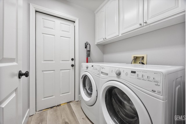 10809 Mirage Dr, Bakersfield, CA 93311 - washroom with cabinet space, washer and clothes dryer, and light wood finished floors