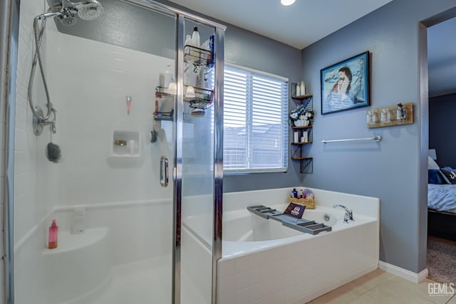 bathroom featuring tile patterned flooring and independent shower and bath