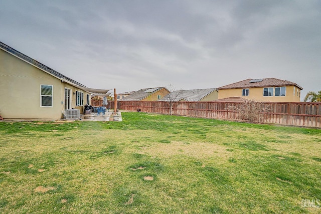 view of yard with a patio and central AC