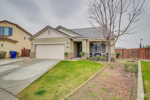 view of front of home with a garage and a front lawn