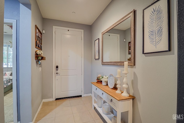 doorway to outside featuring light tile patterned floors