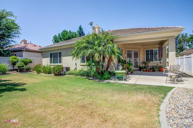 5903 Gold Ranch Way, Bakersfield, CA 93306 - back of property featuring stucco siding, a patio, a chimney, and french doors