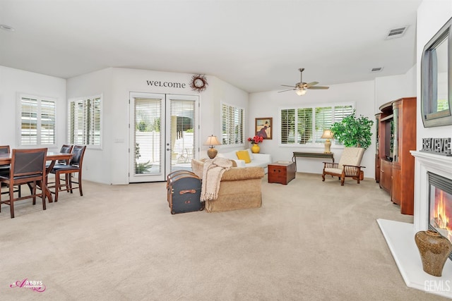5903 Gold Ranch Way, Bakersfield, CA 93306 - living area featuring light carpet, a glass covered fireplace, and ceiling fan