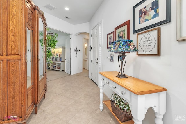 5903 Gold Ranch Way, Bakersfield, CA 93306 - corridor with arched walkways, light tile patterned floors, and recessed lighting