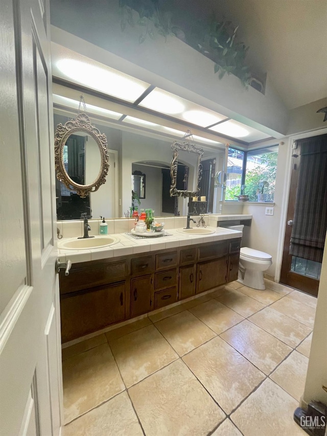 9125 Gleeson Ct, Bakersfield, CA 93311 - bathroom with double vanity and tile patterned flooring