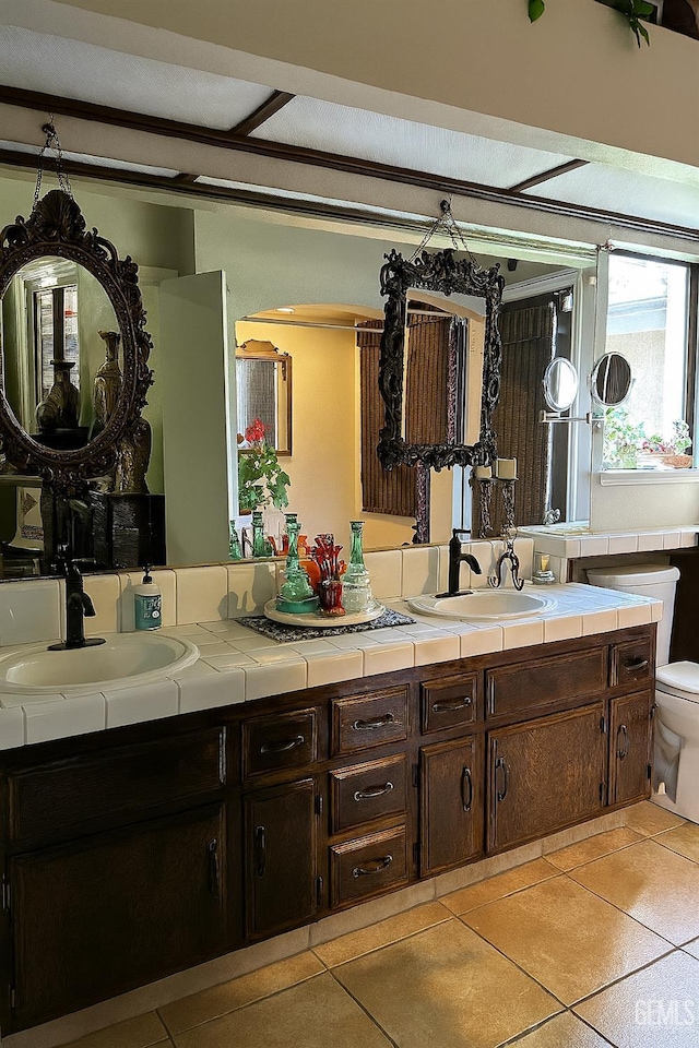 9125 Gleeson Ct, Bakersfield, CA 93311 - bathroom with double vanity and tile patterned floors