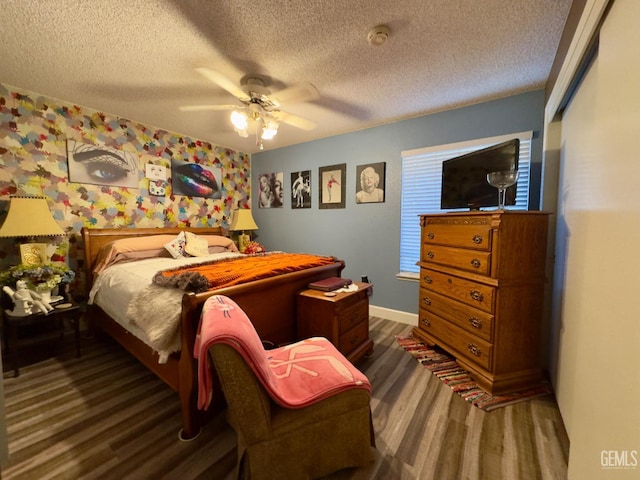 9125 Gleeson Ct, Bakersfield, CA 93311 - bedroom featuring wood finished floors, a textured ceiling, baseboards, and ceiling fan