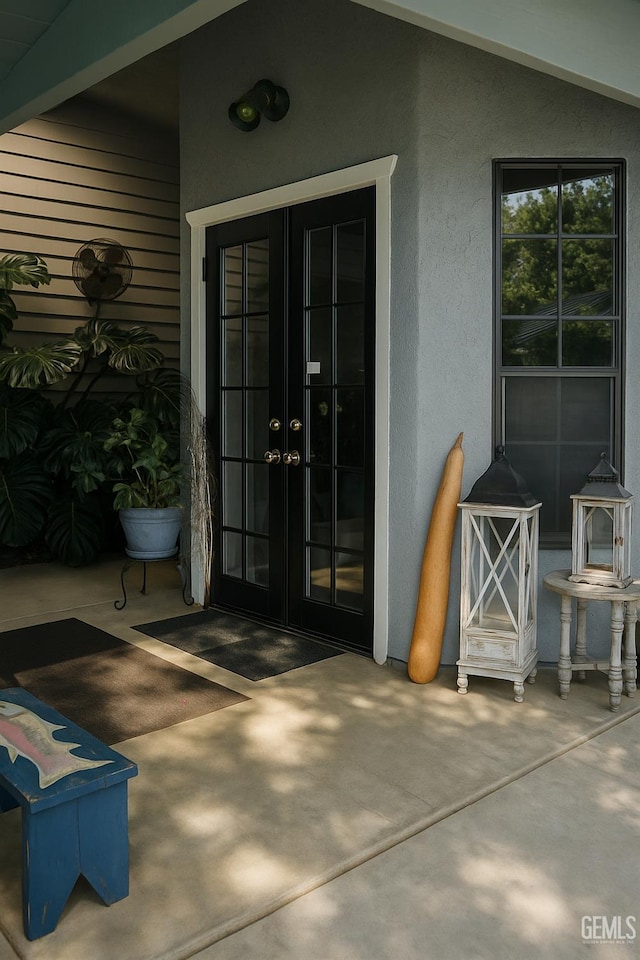 9125 Gleeson Ct, Bakersfield, CA 93311 - doorway to property with french doors, stucco siding, and a patio area