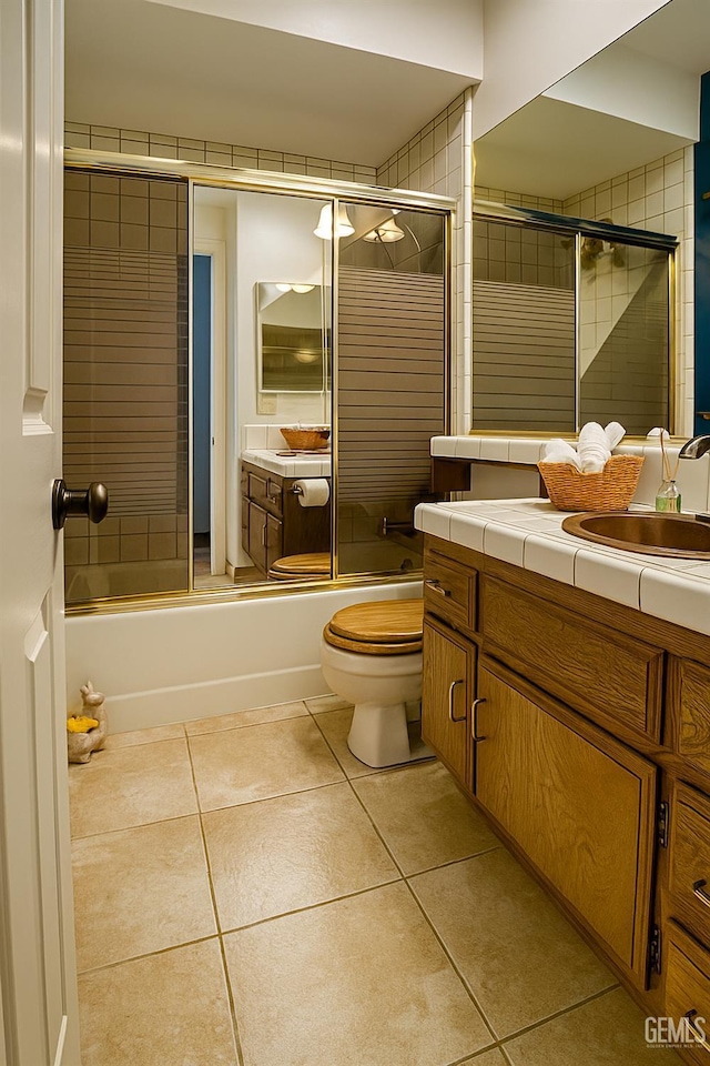 9125 Gleeson Ct, Bakersfield, CA 93311 - bathroom with vanity, bath / shower combo with glass door, and tile patterned flooring
